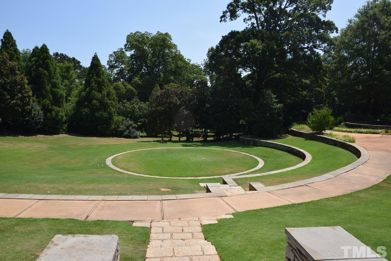 1057 Nichols Drive Raleigh, NC 27605 - Photo 36 of 39 a view of a swimming pool with a yard