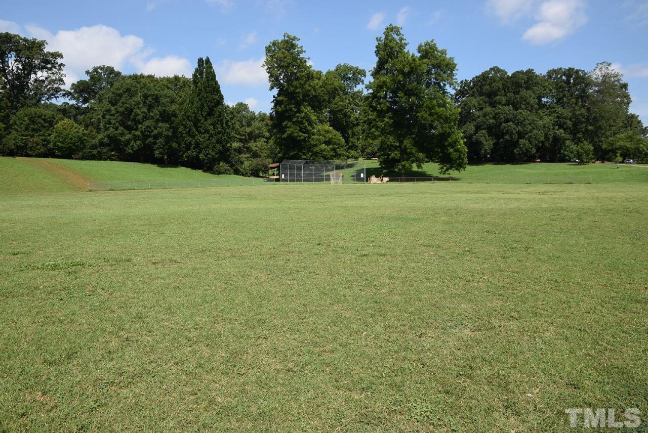 1057 Nichols Drive Raleigh, NC 27605 - Photo 37 of 39 a view of a field with trees in the background