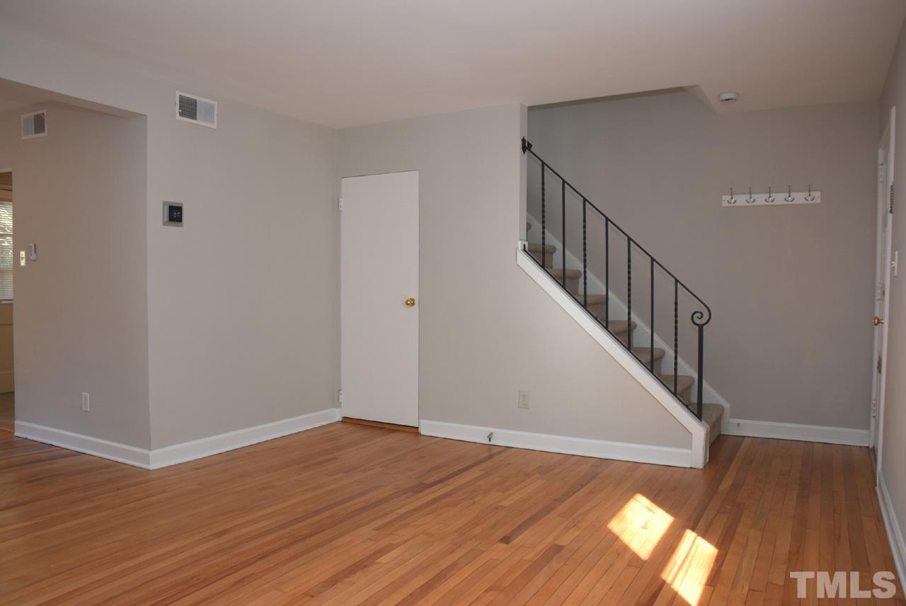 1057 Nichols Drive Raleigh, NC 27605 - Photo 5 of 39 a view of entryway with wooden floor