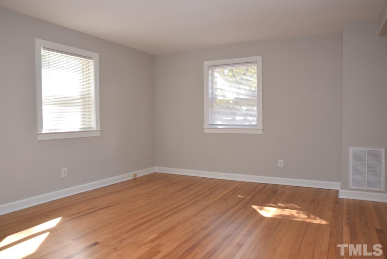 1057 Nichols Drive Raleigh, NC 27605 - Photo 9 of 39 a view of a room with wooden floor and windows