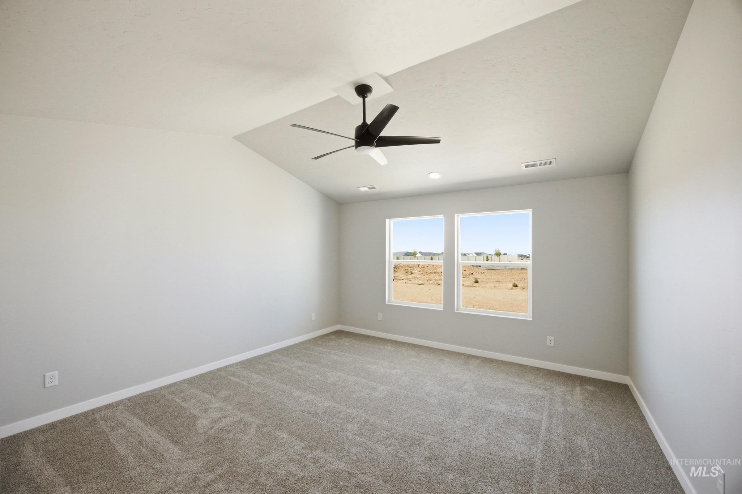4344 East Rincon Drive Meridian, ID 83642 - Photo 21 of 26 Vaulted ceiling with a contemporary ceiling fan, recessed lighting, and dual windows