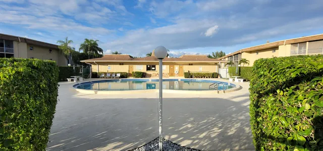 a view of swimming pool with outdoor seating