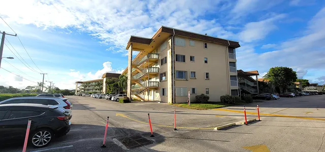 a view of a car park in front of building