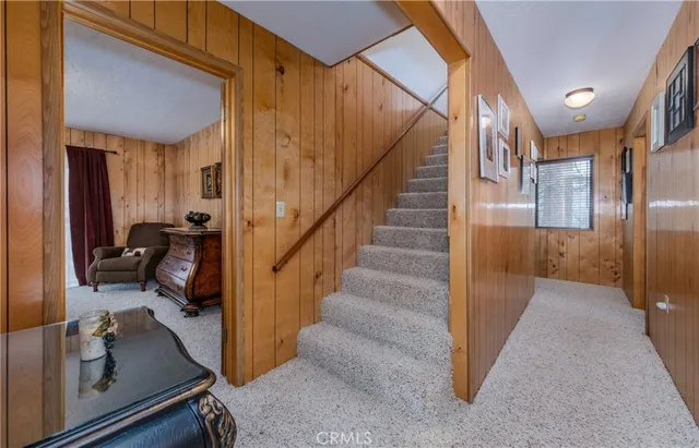 a balcony view with two chairs and a table