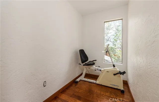 a view of balcony with wooden floor and outdoor seating