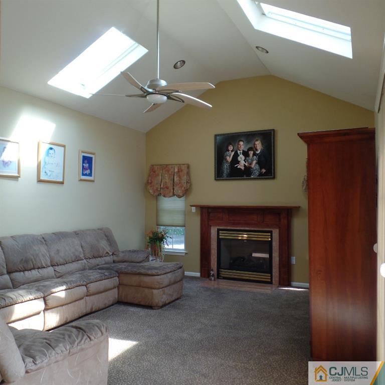 130 Dover Road Colonia, NJ 07067 - Photo 12 of 23 a living room with furniture and a fireplace