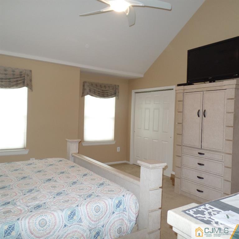 130 Dover Road Colonia, NJ 07067 - Photo 15 of 23 a bedroom with a bed and a television