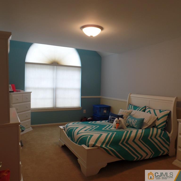 130 Dover Road Colonia, NJ 07067 - Photo 18 of 23 a bedroom with a bed and window