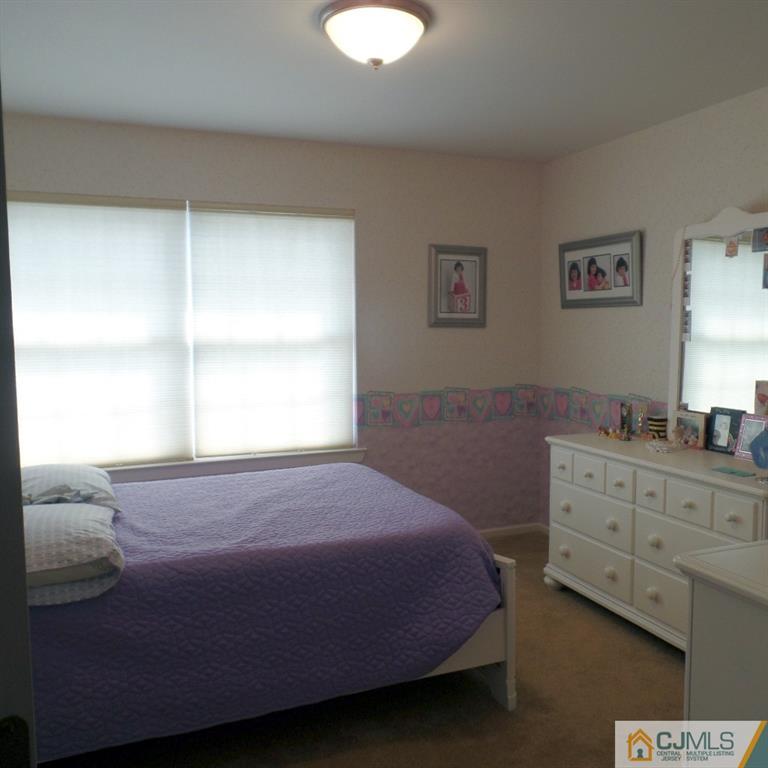 130 Dover Road Colonia, NJ 07067 - Photo 19 of 23 a bedroom with a bed and a window