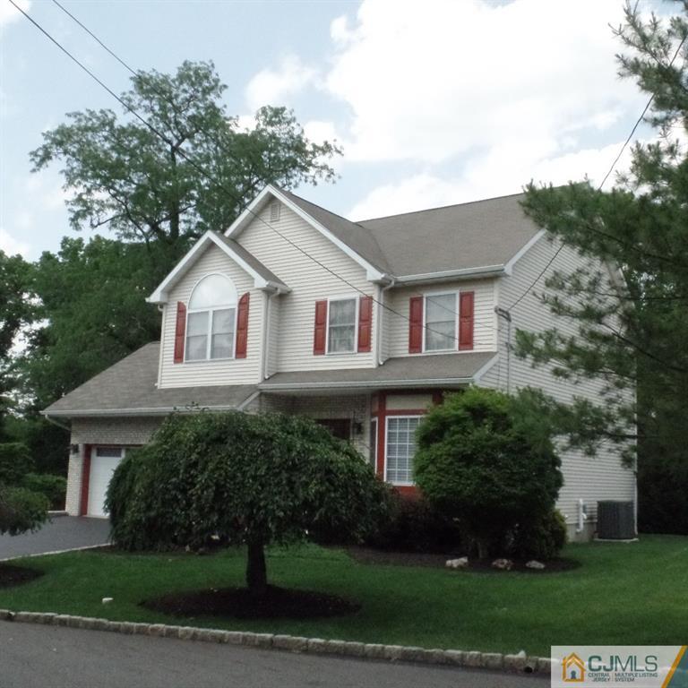 130 Dover Road Colonia, NJ 07067 - Photo 23 of 23 a front view of a house with a yard