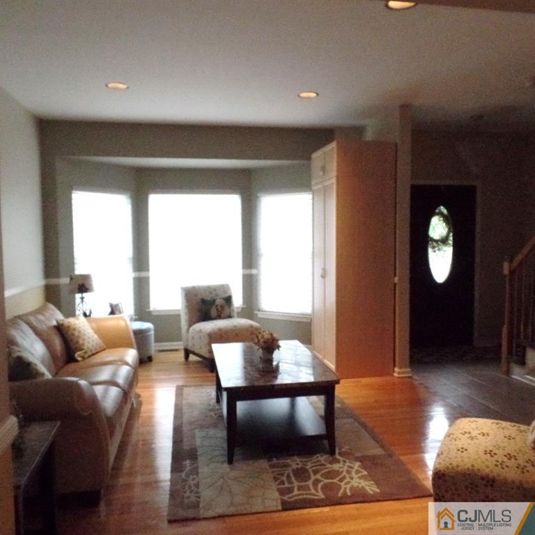 130 Dover Road Colonia, NJ 07067 - Photo 4 of 23 a living room with furniture and a potted plant