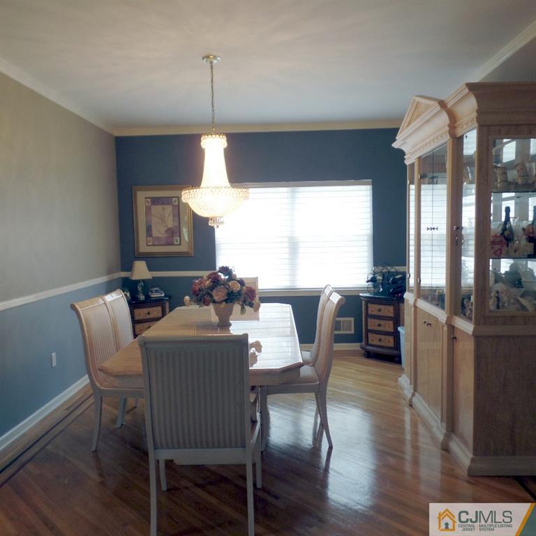130 Dover Road Colonia, NJ 07067 - Photo 5 of 23 a view of a dining room with furniture window and wooden floor