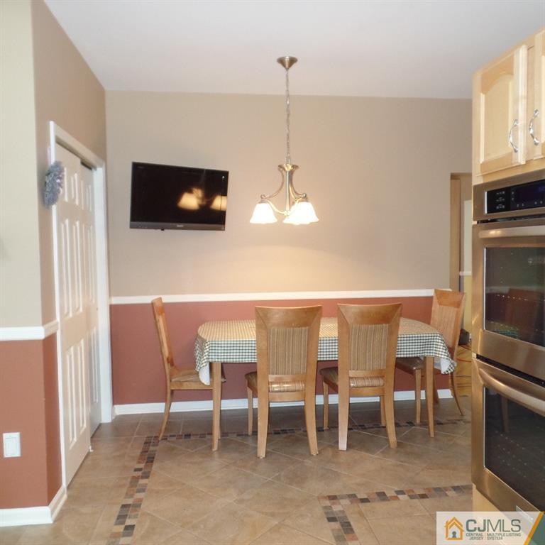 130 Dover Road Colonia, NJ 07067 - Photo 8 of 23 a dining room with furniture and window