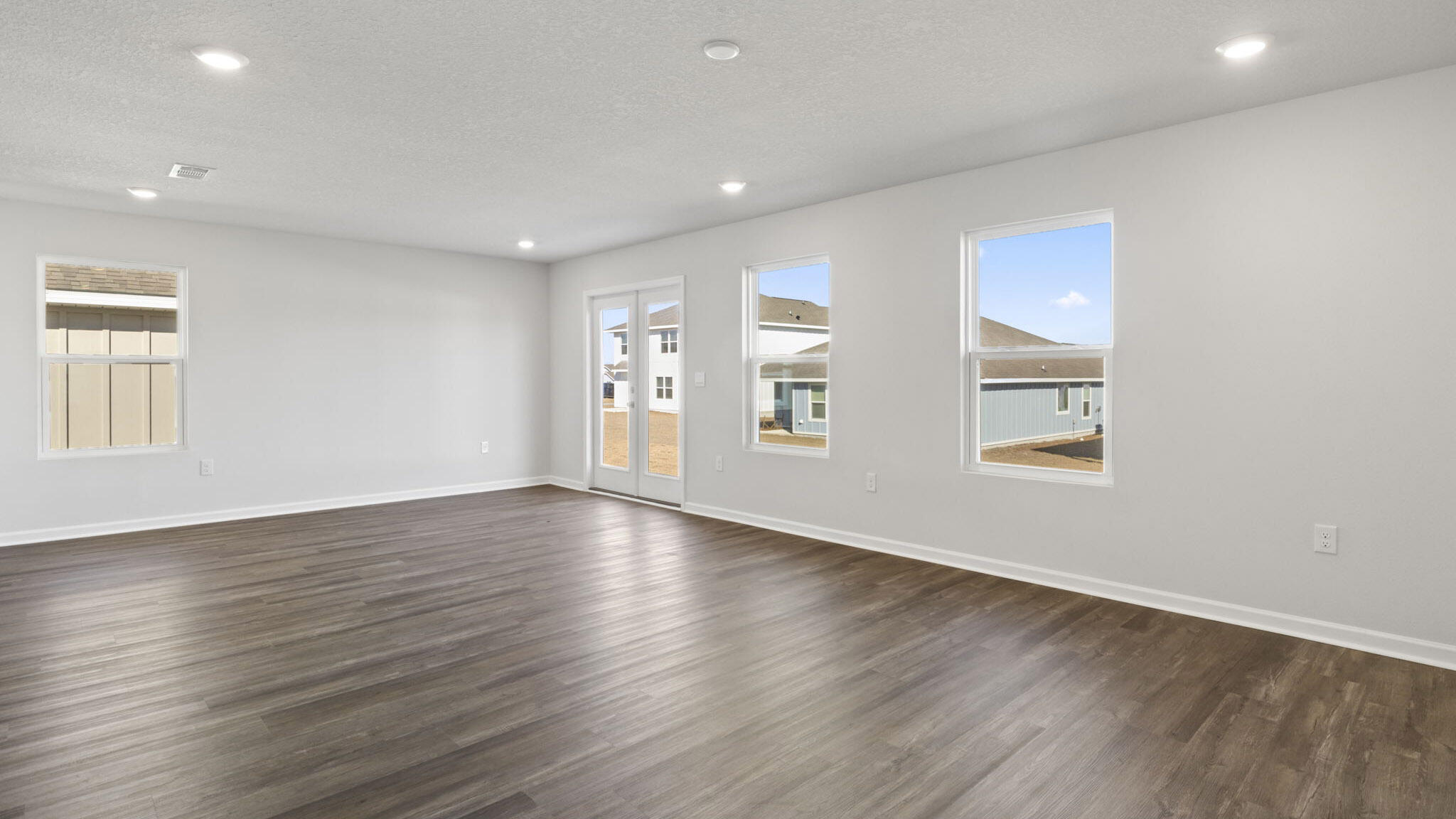 51 Foxtrail Run Freeport, FL 32439 - Photo 7 of 21 an empty room with wooden floor and windows