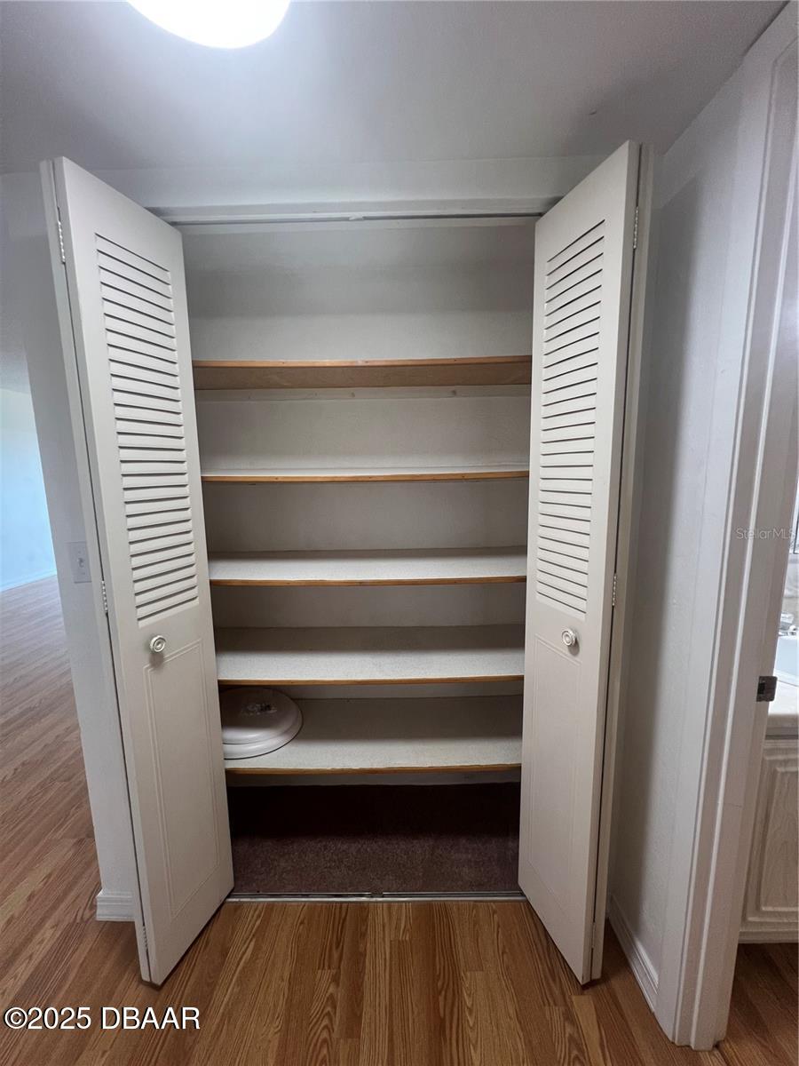 2711 North Halifax Avenue, Unit 593 Daytona Beach, FL 32118 - Photo 17 of 42 a view of walk in closet with empty racks