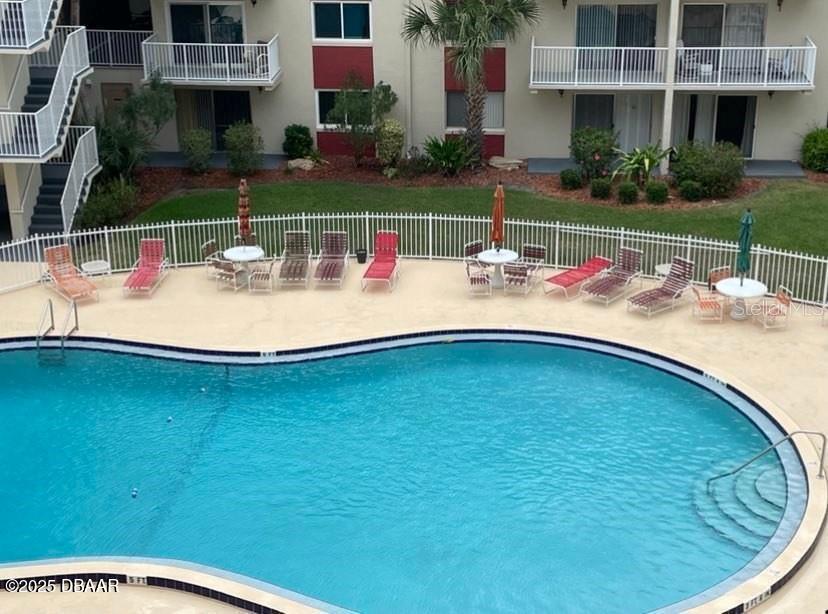 2711 North Halifax Avenue, Unit 593 Daytona Beach, FL 32118 - Photo 28 of 42 a view of a house with backyard and sitting area
