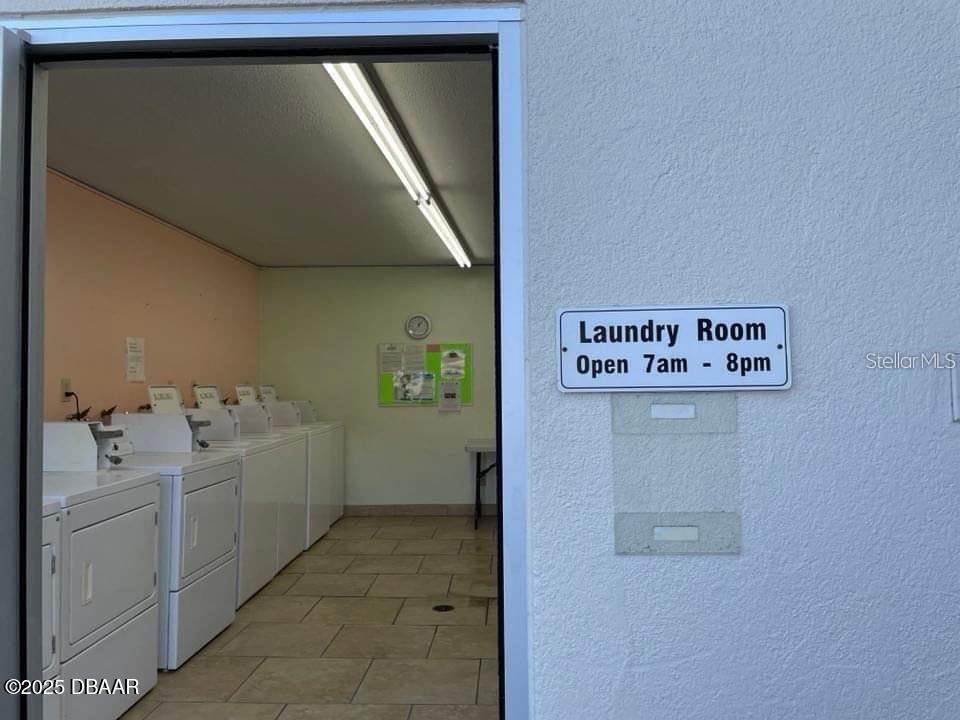 2711 North Halifax Avenue, Unit 593 Daytona Beach, FL 32118 - Photo 34 of 42 a utility room with dryer and washer