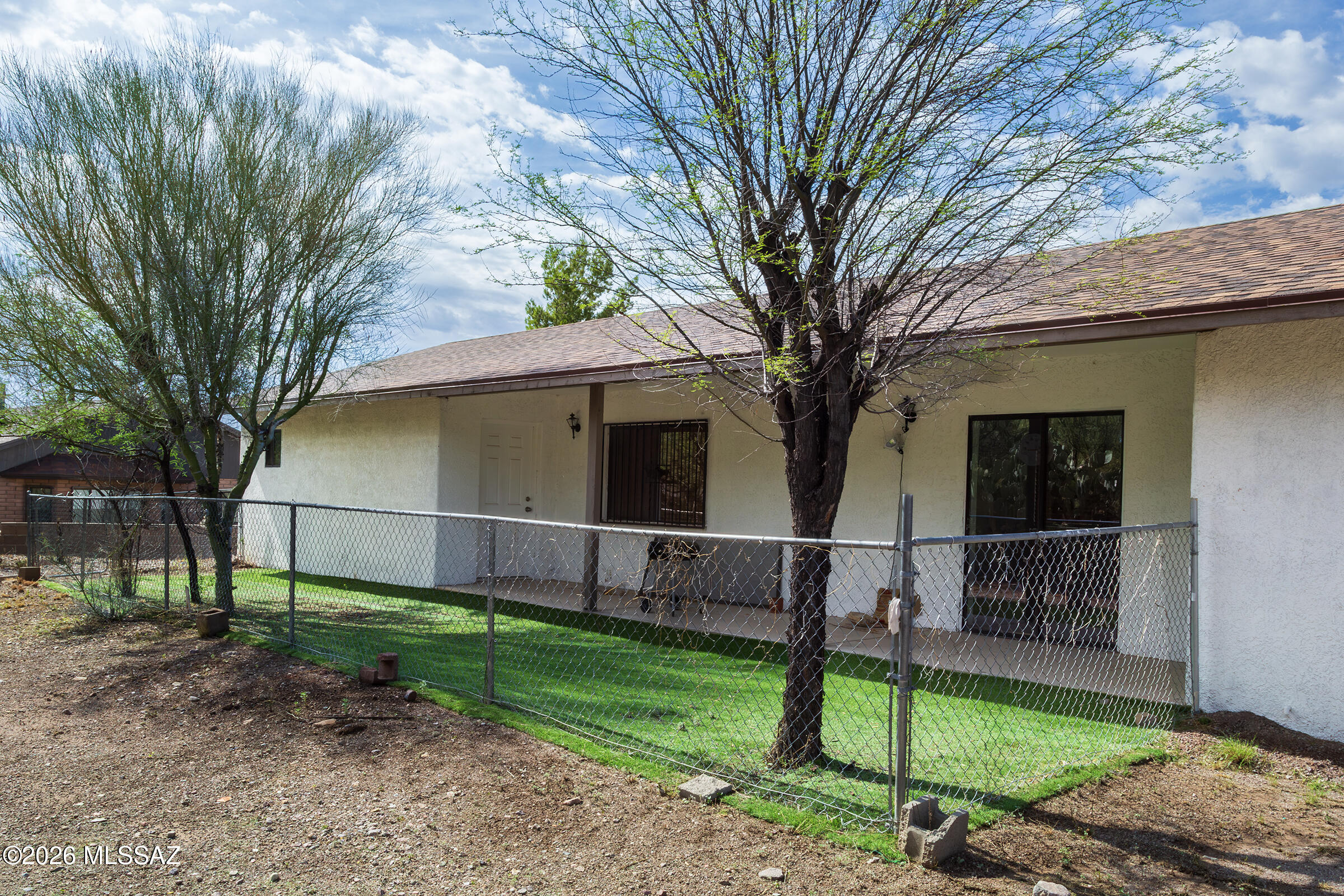 1081 Paseo Freno Rio Rico, AZ 85648 - Photo 35 of 46 a view of a backyard with a tree
