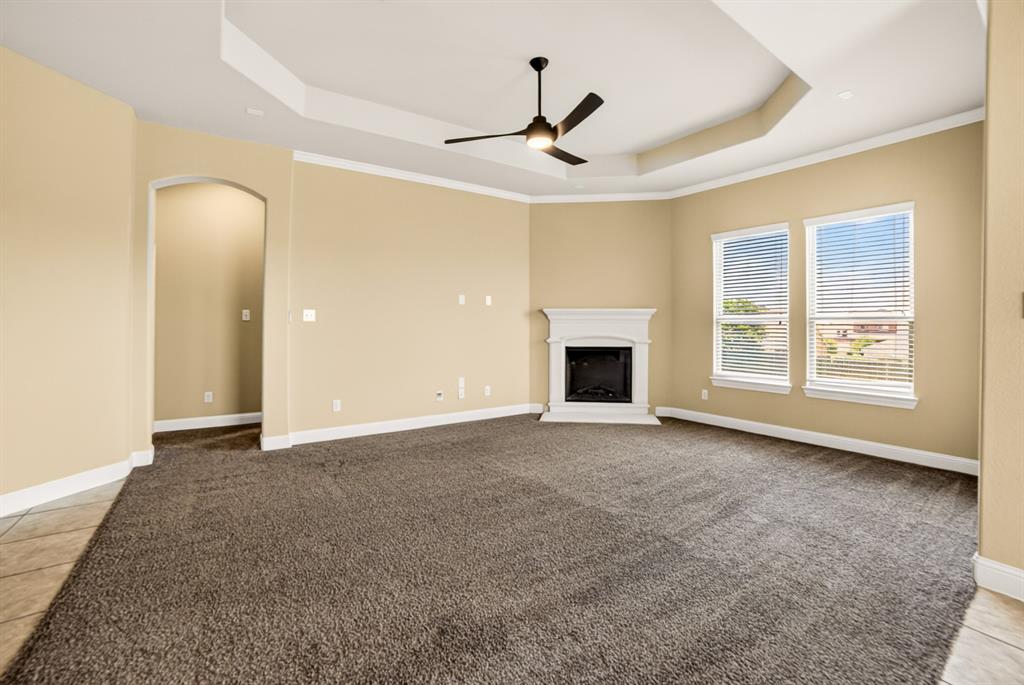 552 Winnetka Drive Oak Point, TX 75068 - Photo 20 of 40 a view of an empty room with window and chandelier fan