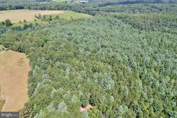 a view of a field with an outdoor space