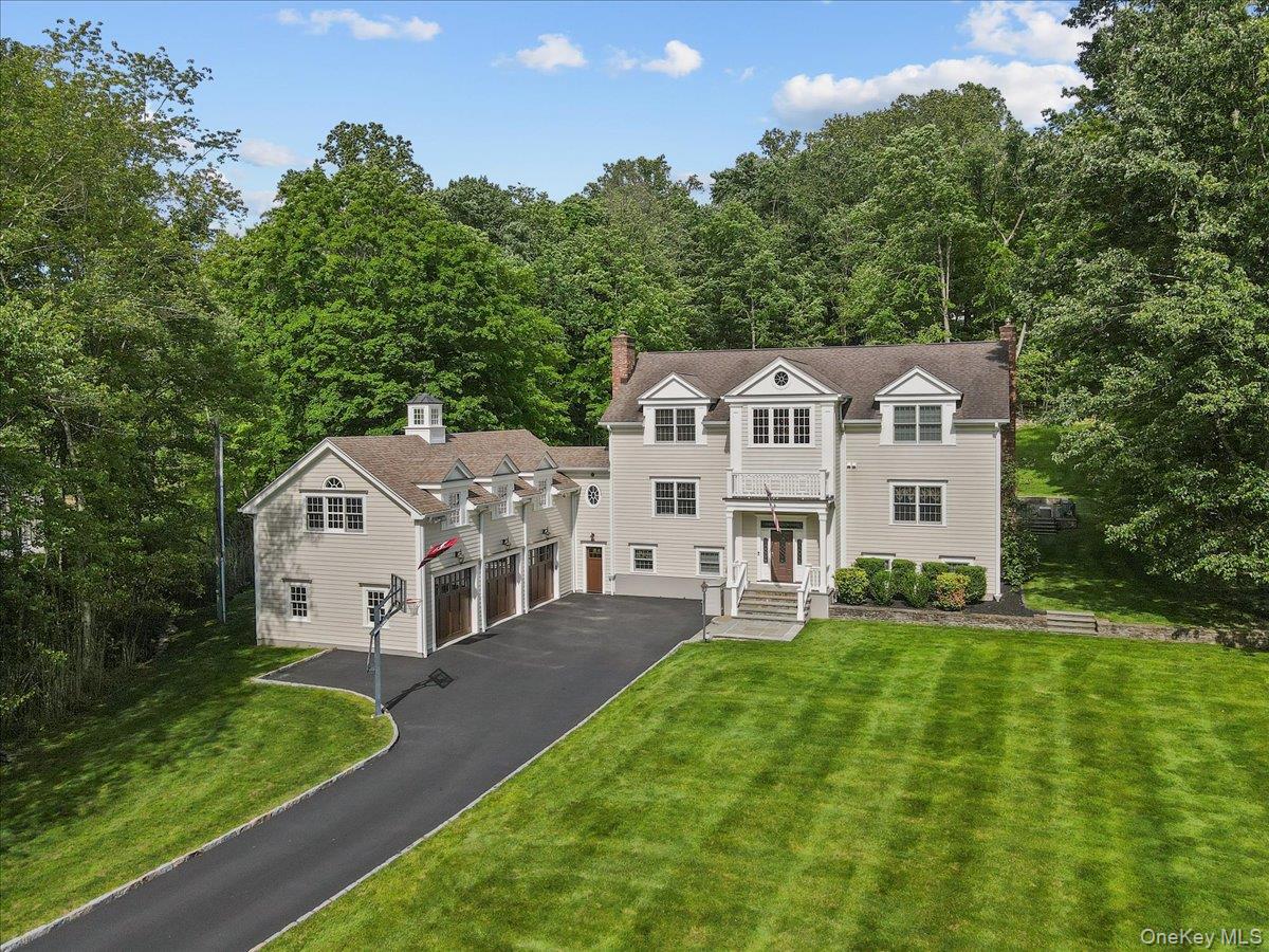 135 Pines Bridge Road Katonah, NY 10536 - Photo 1 of 40 a view of a house with a big yard and large tree