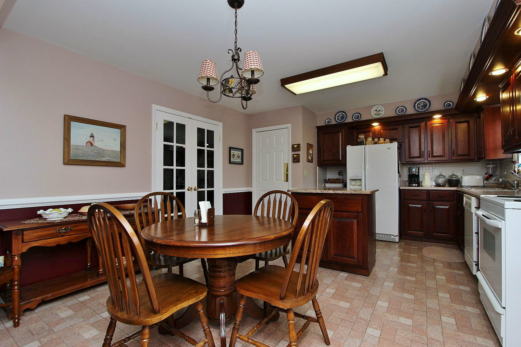 1131 Quarles Road Thaxton, VA 24174 - Photo 22 of 58 a view of a dining room with furniture and chandelier