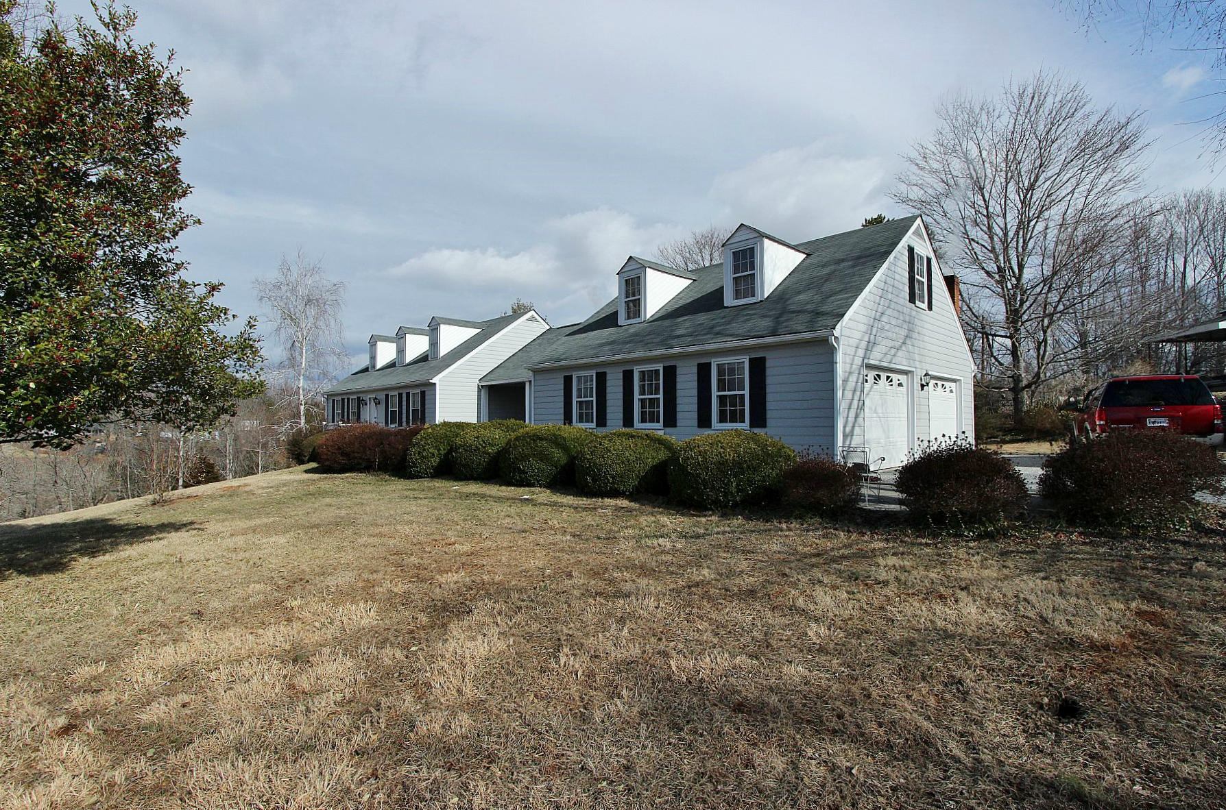 1131 Quarles Road Thaxton, VA 24174 - Photo 6 of 58 a front view of a house with a garden