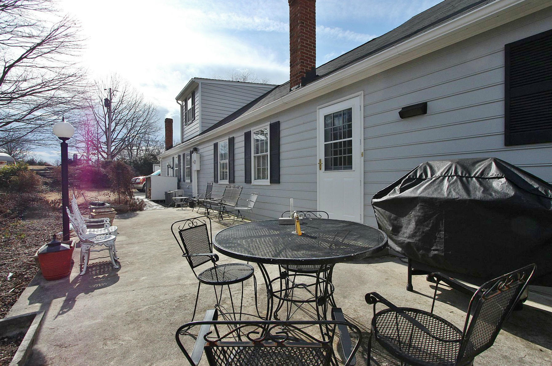1131 Quarles Road Thaxton, VA 24174 - Photo 9 of 58 a view of a patio with table and chairs and barbeque