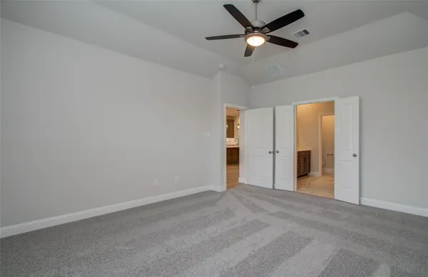 a bathroom with double sink and a mirror