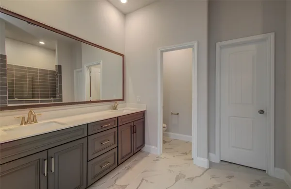 an empty room with a ceiling fan and a window