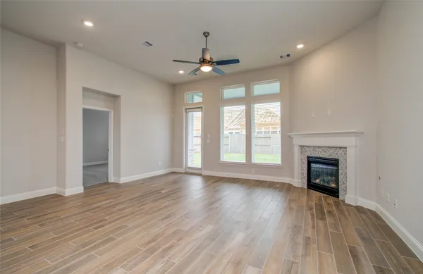 a spacious bathroom with a granite countertop sink mirror and toilet