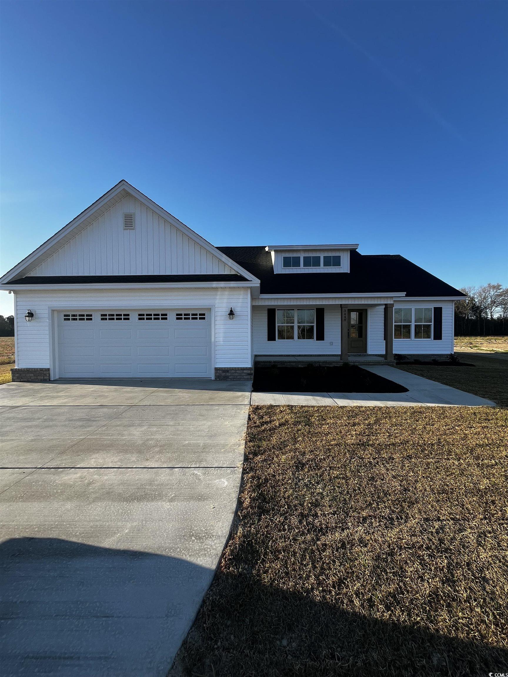 3448 Asbury Road Aynor, SC 29511 - Photo 1 of 7 View of front facade featuring driveway and a gara