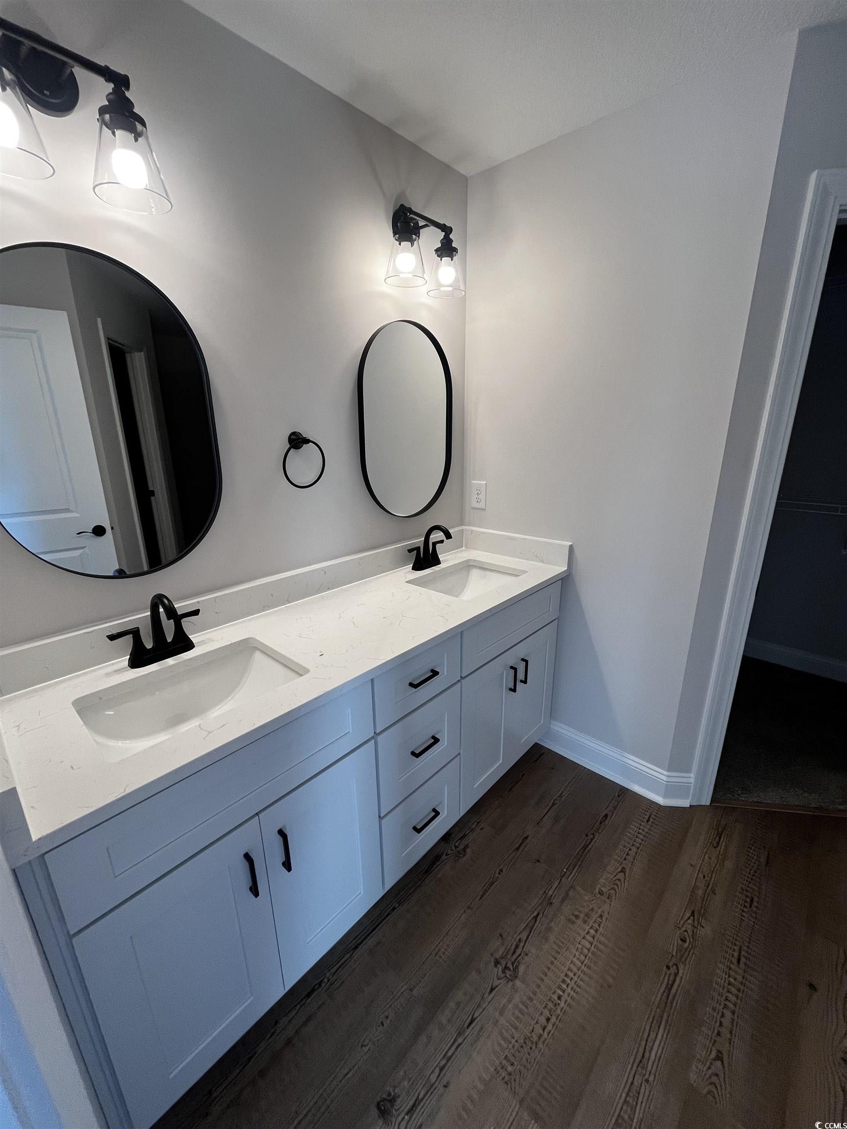 3448 Asbury Road Aynor, SC 29511 - Photo 5 of 7 Bathroom featuring baseboards, double vanity, a si