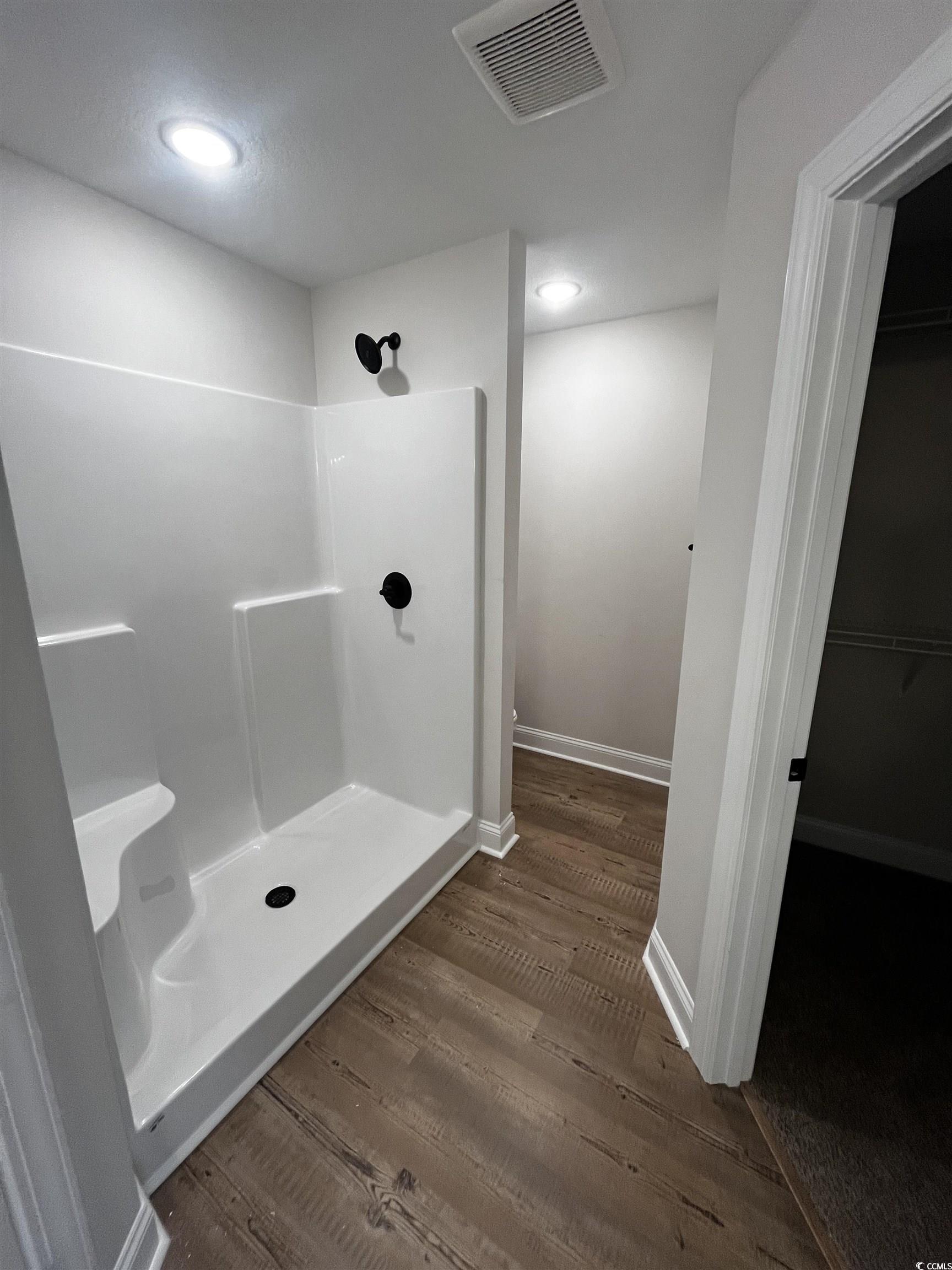 3448 Asbury Road Aynor, SC 29511 - Photo 6 of 7 Bathroom with wood finished floors, a stall shower