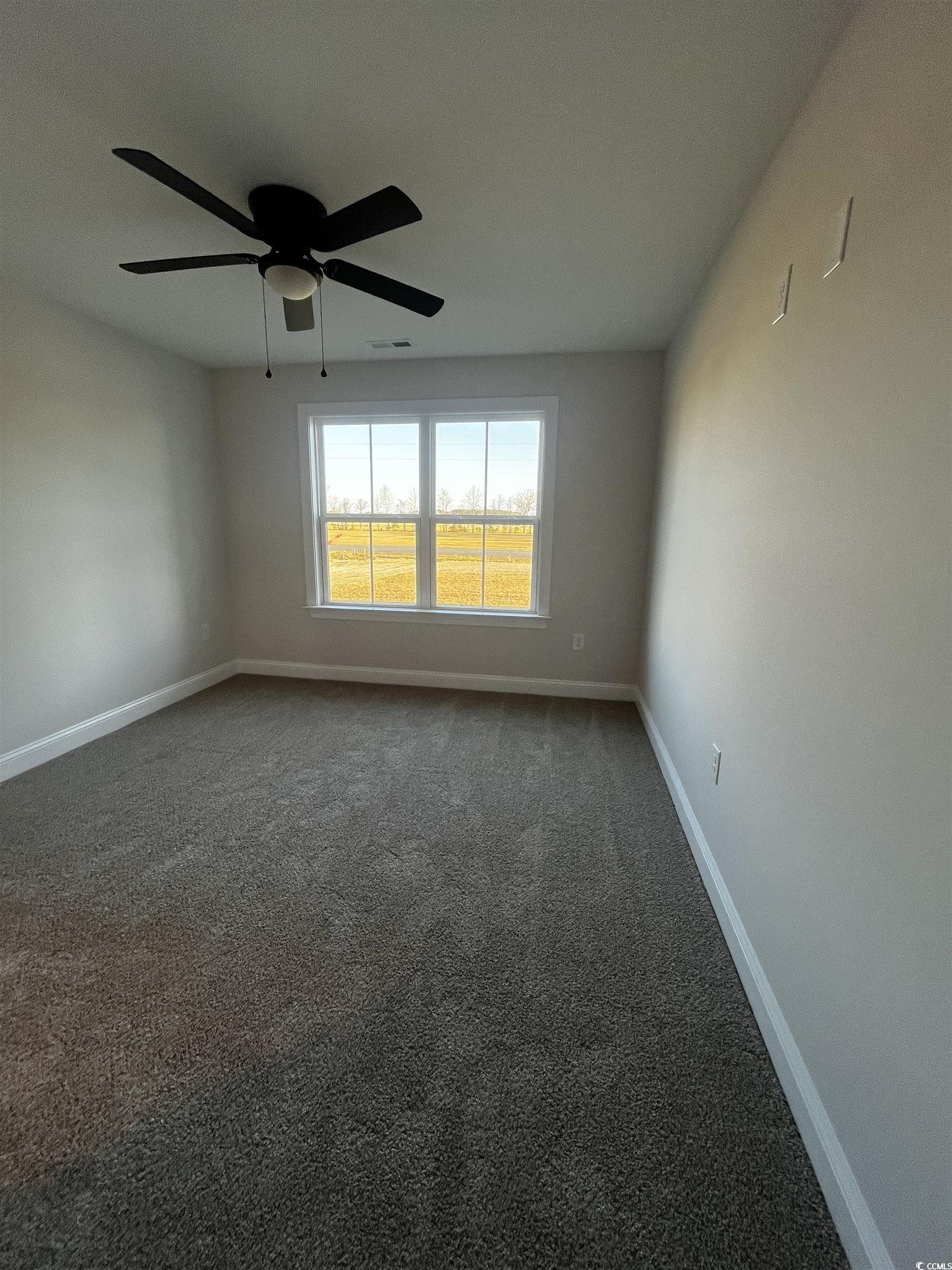 3448 Asbury Road Aynor, SC 29511 - Photo 7 of 7 Carpeted empty room featuring a ceiling fan, baseb