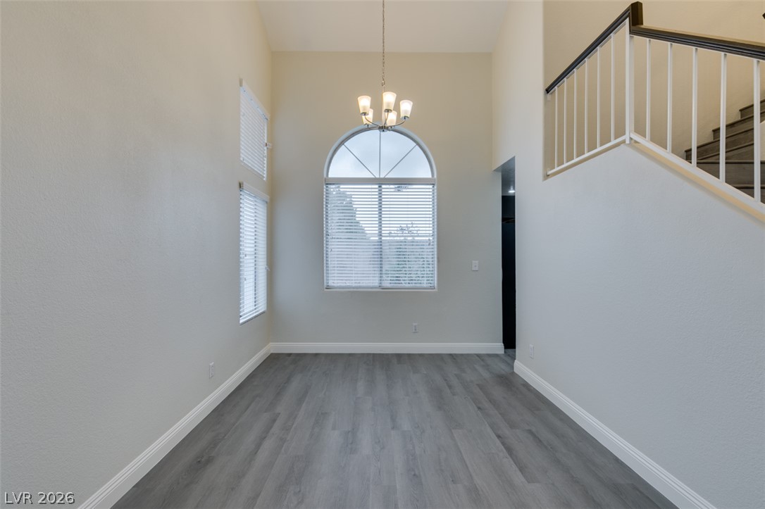 1738 Toltec Circle Henderson, NV 89014 - Photo 14 of 46 Tall ceilings and a large arched window provide an airy feel to this inviting entry space.