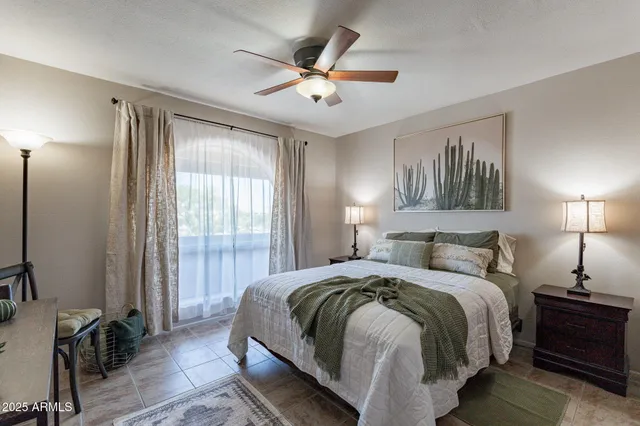 a bedroom with a bed and window