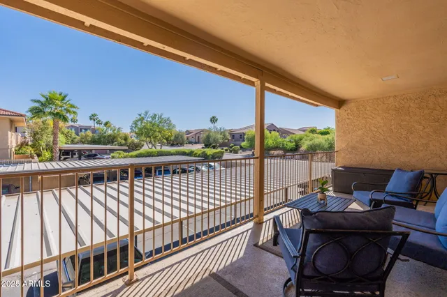 a view of a balcony with furniture