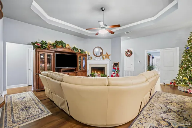 a living room with furniture and a fireplace