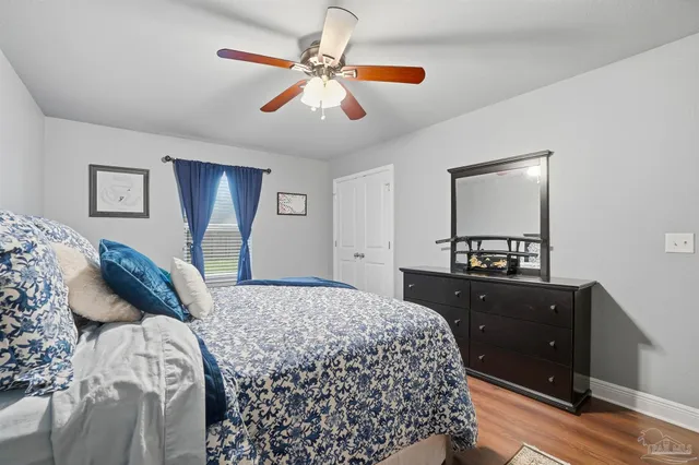 a bedroom with a bed and a dresser