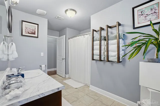 a bathroom with a sink a vanity and a mirror