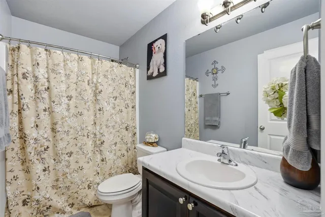 a living room with fireplace furniture and a flat screen tv