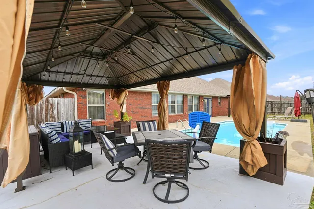 a view of an outdoor sitting area with furniture