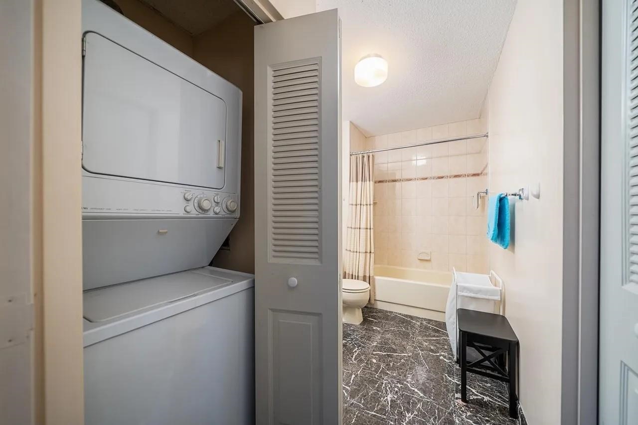 1908 Harmon Cove Tower, Unit 1908 Secaucus, NJ 07094 - Photo 22 of 49 a bathroom with a toilet and a shower