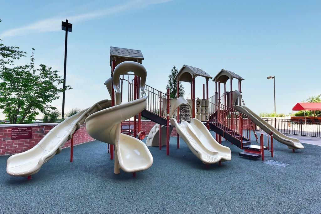 1908 Harmon Cove Tower, Unit 1908 Secaucus, NJ 07094 - Photo 28 of 49 a living room with two couches and large trees