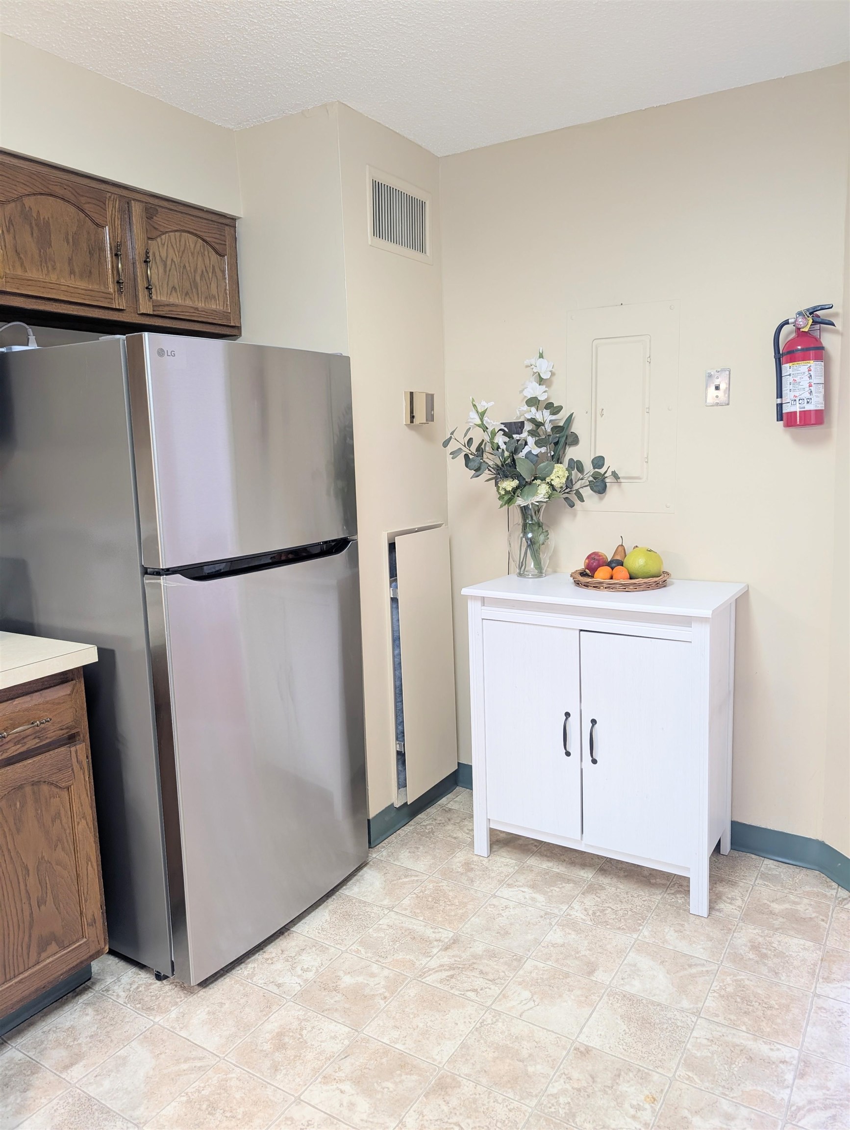 1908 Harmon Cove Tower, Unit 1908 Secaucus, NJ 07094 - Photo 10 of 49 a view of kitchen with refrigerator cabinets and wooden floor