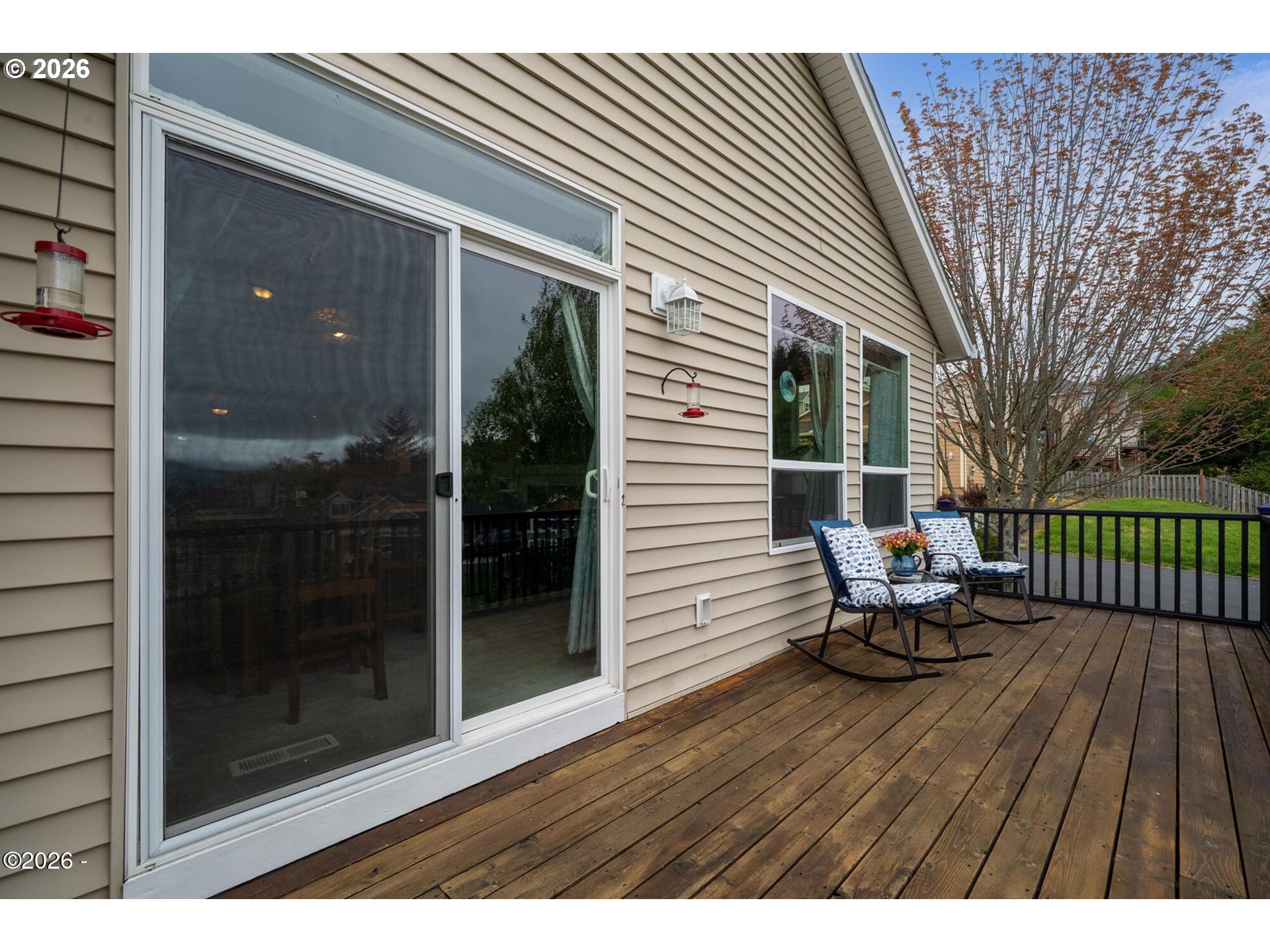 4365 Sequoia Loop Netarts, OR 97141 - Photo 15 of 44 a balcony with couple of chairs and wooden fence