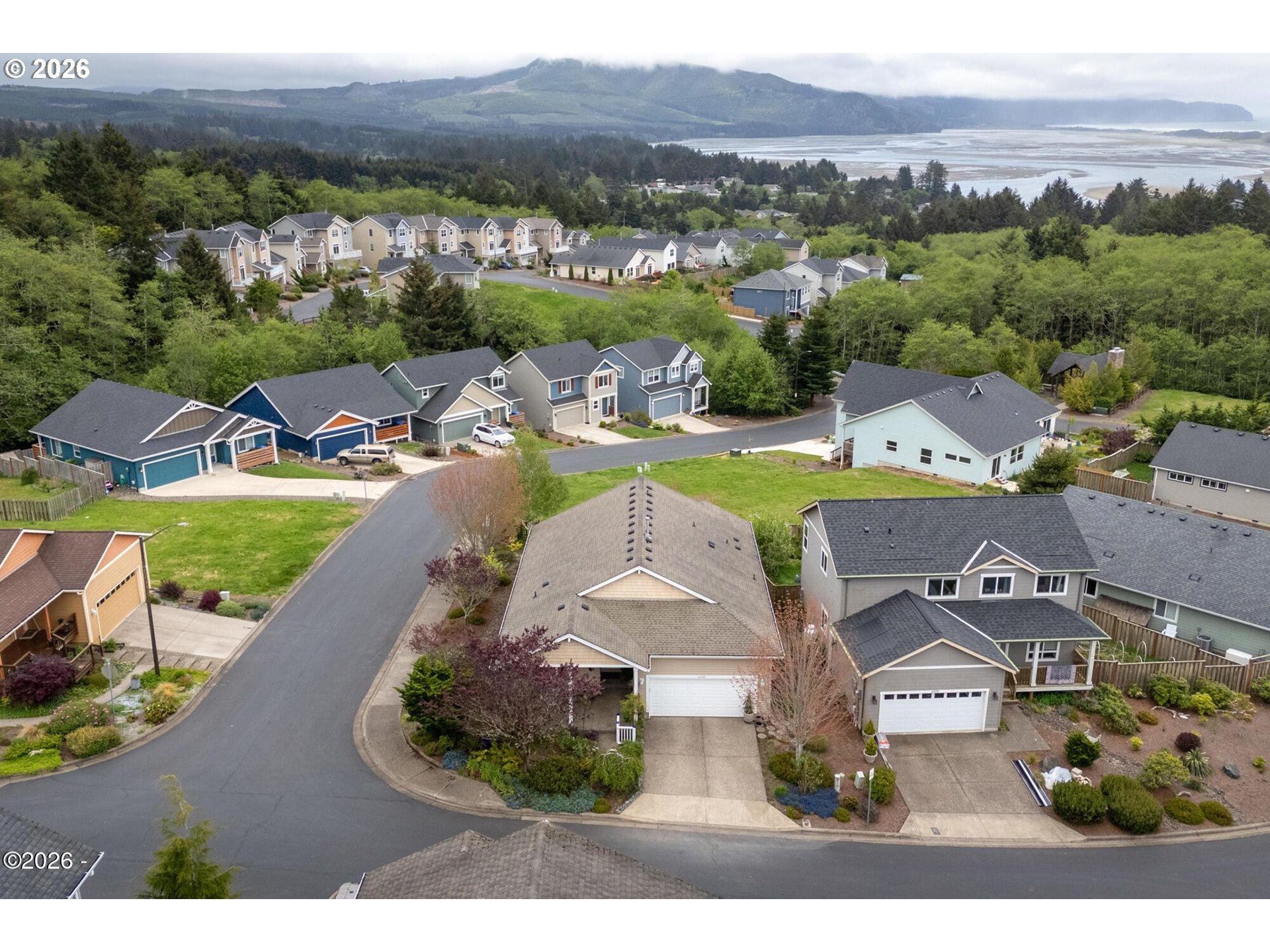 4365 Sequoia Loop Netarts, OR 97141 - Photo 43 of 44 an aerial view of a house with a garden