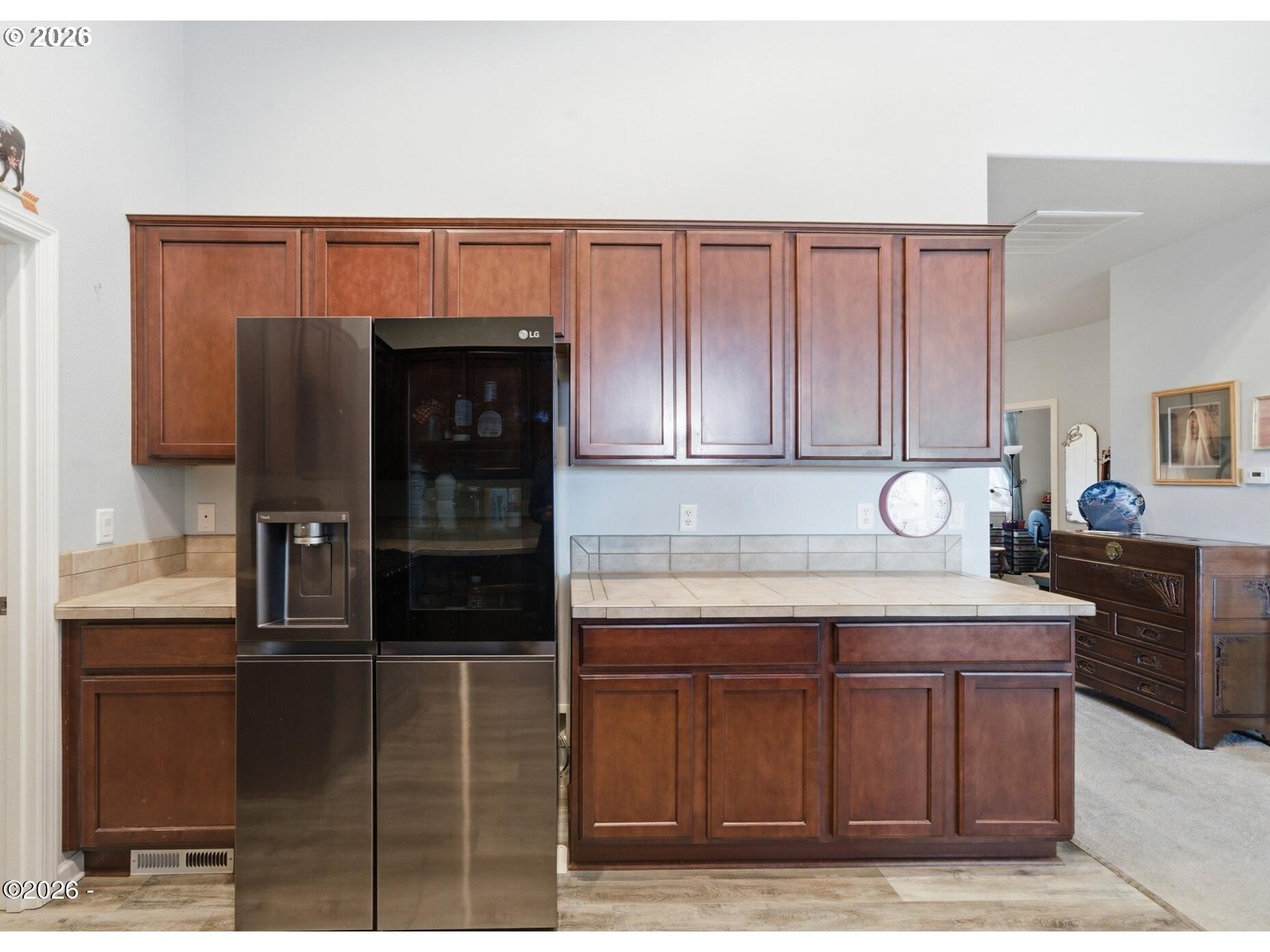 4365 Sequoia Loop Netarts, OR 97141 - Photo 6 of 44 a kitchen with stainless steel appliances kitchen island granite countertop a refrigerator and a stove top oven