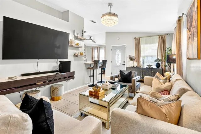 a living room with furniture and a flat screen tv